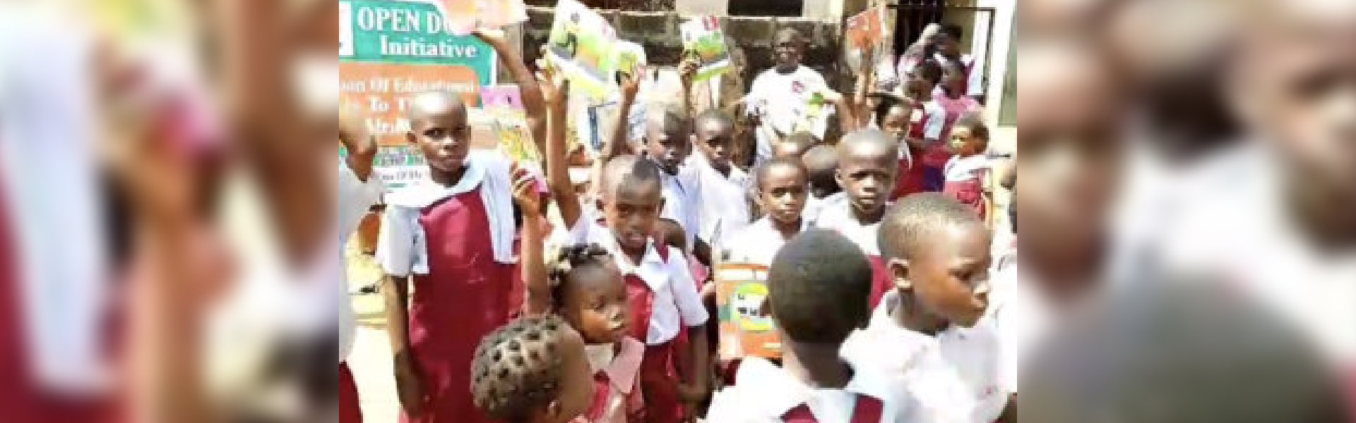 Kids wearing uniforms holding papers